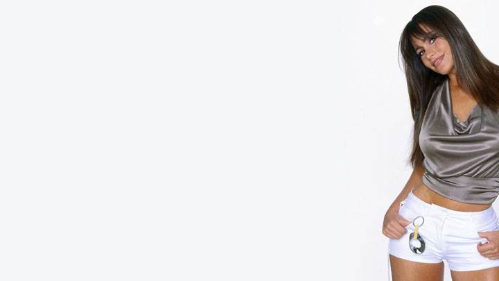 Sofia Vergara Smiling In Grey Top Modeling Pose
